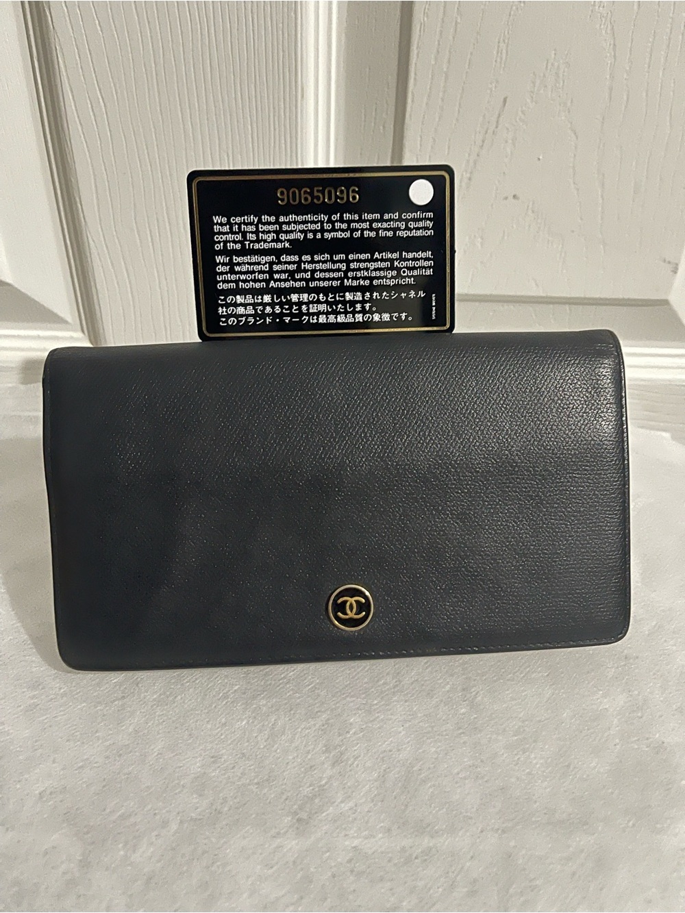 CHANEL Black Leather Clutch with Gold CC Emblem(comes with box and dust cloth)